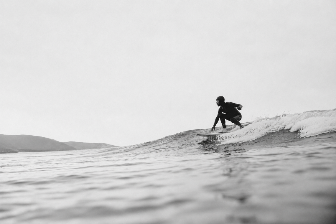 Surfing the calm, overcast waves