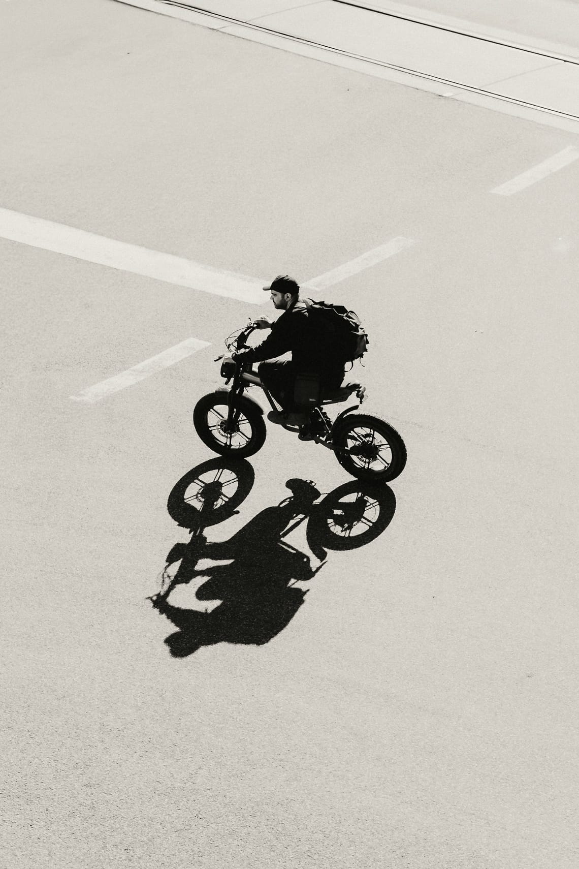 Rider crossing an empty street