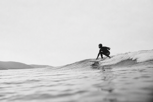 Surfing the calm, overcast waves
