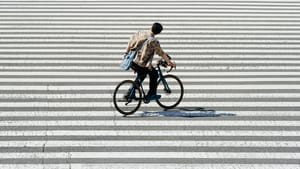 Urban Cyclist Crossing the Street