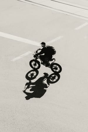 Rider crossing an empty street